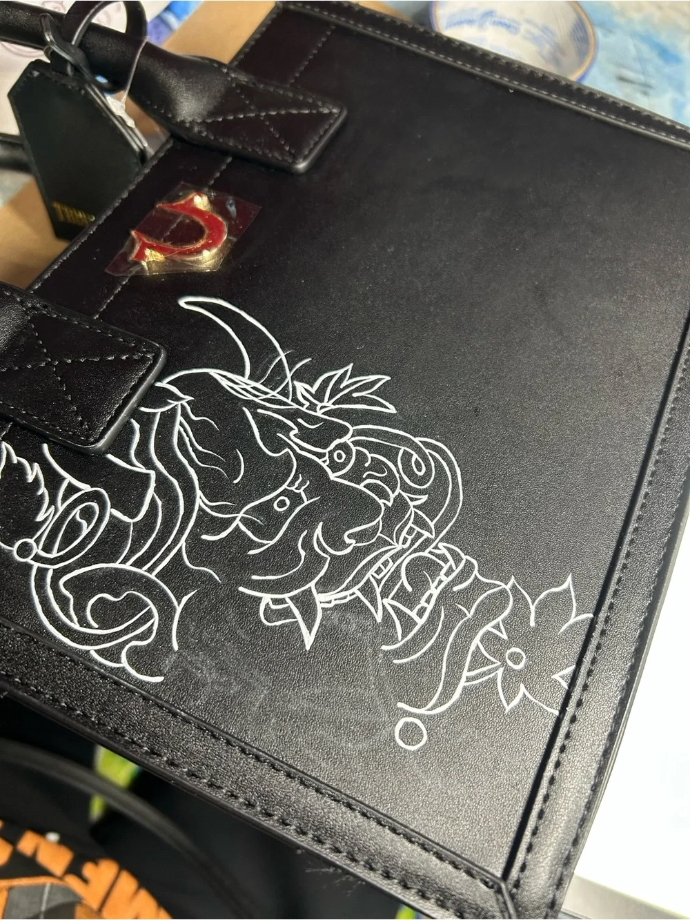 True Religion Black Satchel with White Graphic Demon Motif